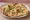 Garlic Naan: an illustration of garlic, cilantro and butter on naan.