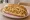 Garlic Noodle Sandwich: an illustration of garlic, butter, scallion and maggi seasoning sauce on hoagie roll.