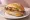 Geflügelbratwurst: an illustration of sausage and mustard on bread.