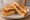 Gilgeori Toast — Bacon: an illustration of bacon, egg, cabbage, carrot and more on white bread.