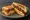 Gilgeori Toast — Bulgogi: an illustration of beef, egg, cabbage, carrot and more on white bread.