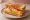 Gilgeori Toast — Classic Egg & Cheese: an illustration of egg, cabbage, carrot, american cheese and more on white bread.