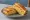 Gilgeori Toast — Corn Cheese: an illustration of egg, corn, american cheese, cabbage and more on white bread.