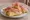 Gnocco Fritto con Prosciutto: an illustration of the sandwich.