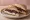 Goat Cheese and Red Onion: an illustration of goat cheese, onion, balsamic and butter on white bread.