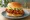 Gochujang Chicken Sandwich: an illustration of chicken, gochujang, mayonnaise, lettuce and more on burger bun.