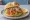 Graved Lachs Brötchen: an illustration of salmon, mustard and dill on bread.