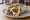 Greek-American Gyro - New York: an illustration of beef, lamb, tzatziki, tomato and more on pita.