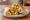 Green Chile Breakfast Burrito: an illustration of egg, potato and cheese on tortilla.