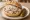 Griebenschmalz Brötchen: an illustration of pork and onion on rye bread.