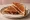 Grilled PB&J: an illustration of peanut butter, jam and butter on white bread.