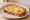 Grzanki z Serem: an illustration of cheese and butter on bread.