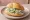 Gurkensalat Brötchen: an illustration of cucumber and vinegar on bread.