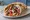 Gyros Hirino se Pita (Γύρος Χοιρινό σε Πίτα): an illustration of pork, tomato, onion, tzatziki and more on pita.