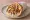 Gyros Kotopoulo (Γύρος Κοτόπουλο): an illustration of chicken, tomato, onion, tzatziki and more on pita.