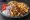 Gyros Kotopoulo Merida: an illustration of chicken, tomato, onion, tzatziki and more on pita.