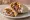 Gyros Wrap (Tortilla): an illustration of pork, chicken, tzatziki, tomato and more on tortilla.