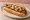 Half-Smoke: an illustration of sausage, pepper, mustard and onion on hot dog bun.