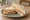 Ham and Cheese: an illustration of ham, american cheese and mustard on white bread.