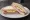 Ham and Egg: an illustration of ham, egg and butter on white bread.