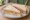 Ham and Mustard: an illustration of ham, mustard and butter on white bread.