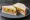 Ham and Piccalilli: an illustration of ham and butter on white bread.