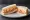 Ham and Pimiento Cheese: an illustration of ham, cheddar cheese and mayonnaise on white bread.