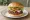Hamburger: an illustration of beef, lettuce, tomato, onion and more on burger bun.