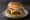 Hamburguesa Argentina: an illustration of beef, ham, cheese, egg and more on burger bun.