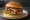 Hamburguesa con Panceta: an illustration of beef, bacon, lettuce, tomato and more on burger bun.