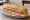 Hero Sandwich: an illustration of ham, salami, provolone, lettuce and more.