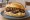 Himmel un Ääd: an illustration of potato, apple and onion on kaiser roll.