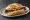 Hofer Bratwurst: an illustration of mustard on kaiser roll.