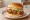 Honey Butter Chicken Sandwich: an illustration of chicken, butter and honey.