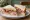 Honey Roast Ham Sandwich: an illustration of ham, butter, honey and mustard on white bread.