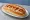 Hot Dog - Japanese (ホットドッグ): an illustration of sausage, ketchup, mustard and cabbage.