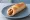 Hot Dog Polski: an illustration of sausage, ketchup and mustard.