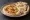 Hummus b'Khubz (حمص بالخبز): an illustration of hummus, chickpeas, tahini, lemon and more on pita.