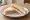 Hundreds and Thousands Sandwich: an illustration of butter on white bread.