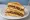 Isaac Toast — Bulgabi Toast (불갈비 토스트): an illustration of bulgogi, egg, cabbage, cheese and more on white bread.