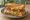 Isaac Toast — MVP Toast: an illustration of beef, ham, egg, cheese and more on white bread.