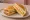 Isaac Toast — Original (이삭토스트): an illustration of ham, egg, cheese, cabbage and more on white bread.