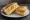 Isaac Toast — Vegetarian Toast: an illustration of egg, cheese, cabbage and butter on white bread.
