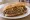Italian Beef: an illustration of beef, au jus, giardiniera and pepper.