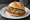 Jägerschnitzel Brötchen: an illustration of pork, mushroom, onion and bacon on kaiser roll.