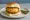 Jain Vada Pav: an illustration of potato, pepper, ginger, cilantro and more on bread.