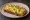 Jajecznica na Chlebie: an illustration of egg, butter and pepper on bread.