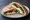 Jibneh Sandwich (ساندويش جبنة): an illustration of cheese on pita.