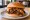 K-BBQ Sandwich (Global trend): an illustration of beef, gochujang, kimchi and scallion on burger bun.