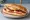 Kahvaltı Sandviç: an illustration of sucuk, egg, cheese and tomato on bread.
